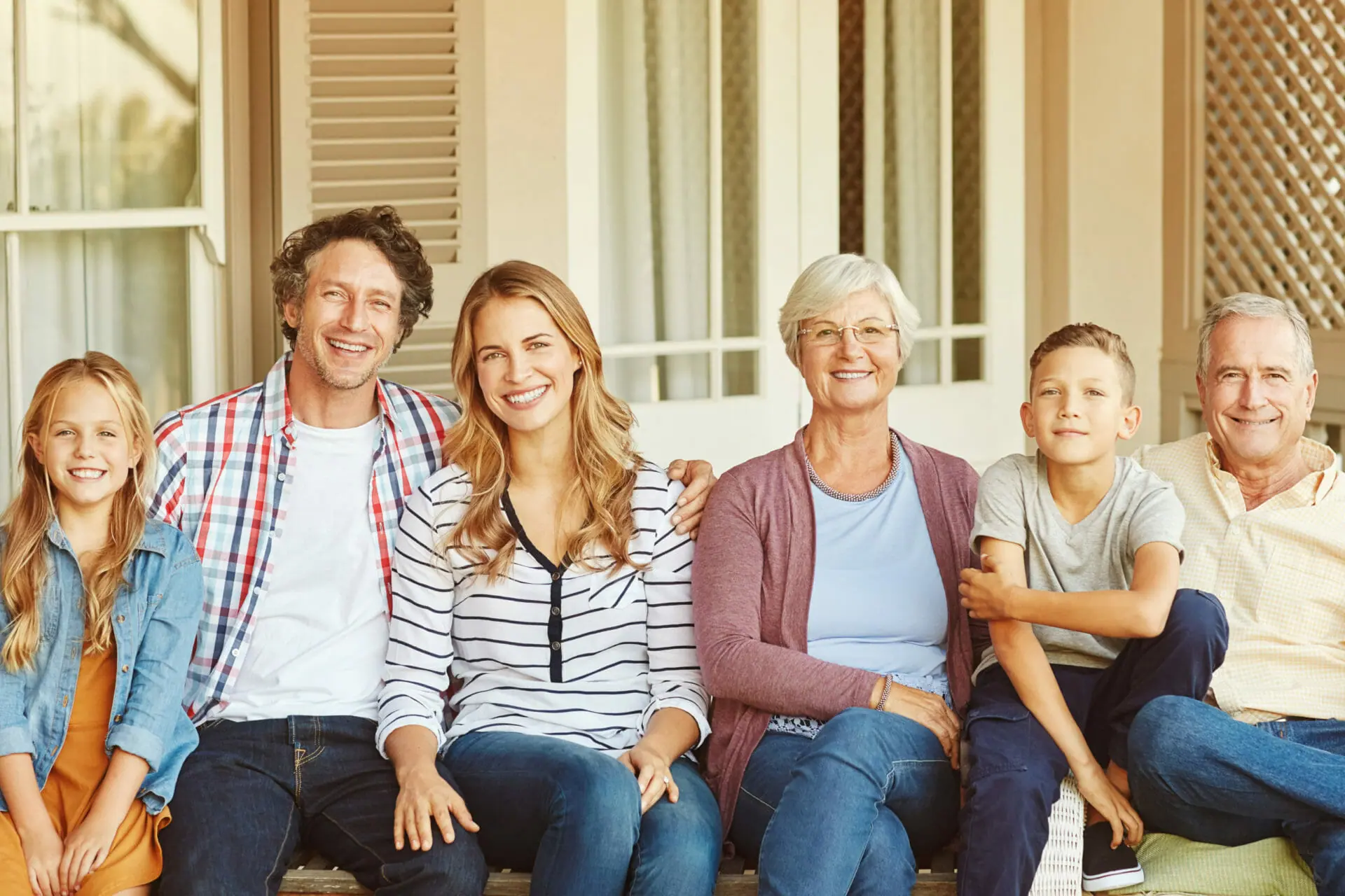 Cropped portrait of a family of six sitting outside